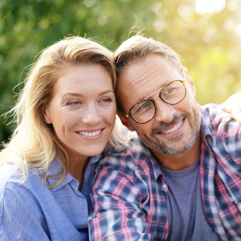 Portrait of cheerful mature couple taking selfie picture